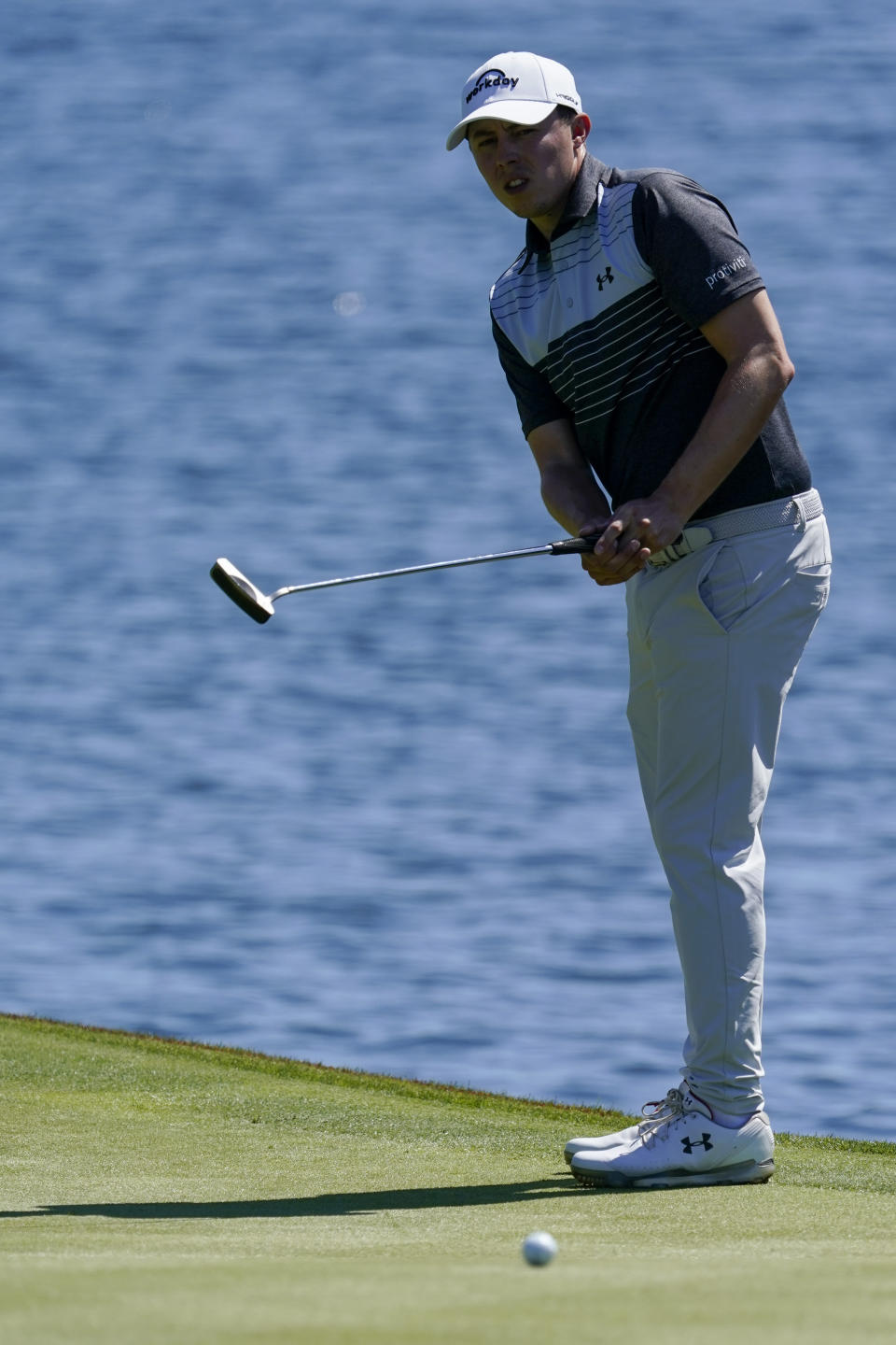 Matthew Fitzpatrick of England watches his putt on the 18th hole during the first round of the The Players Championship golf tournament Thursday, March 11, 2021, in Ponte Vedra Beach, Fla. (AP Photo/John Raoux)