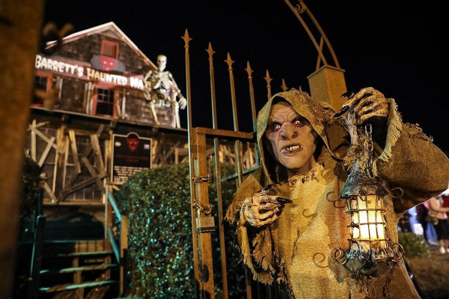 An actor patrols the grounds of Barrett’s Haunted Mansion in Abington.