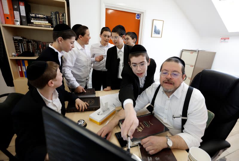 Rabbi Zvi Lebovics talks with pupils at the Beis Medrash Elyon school in London