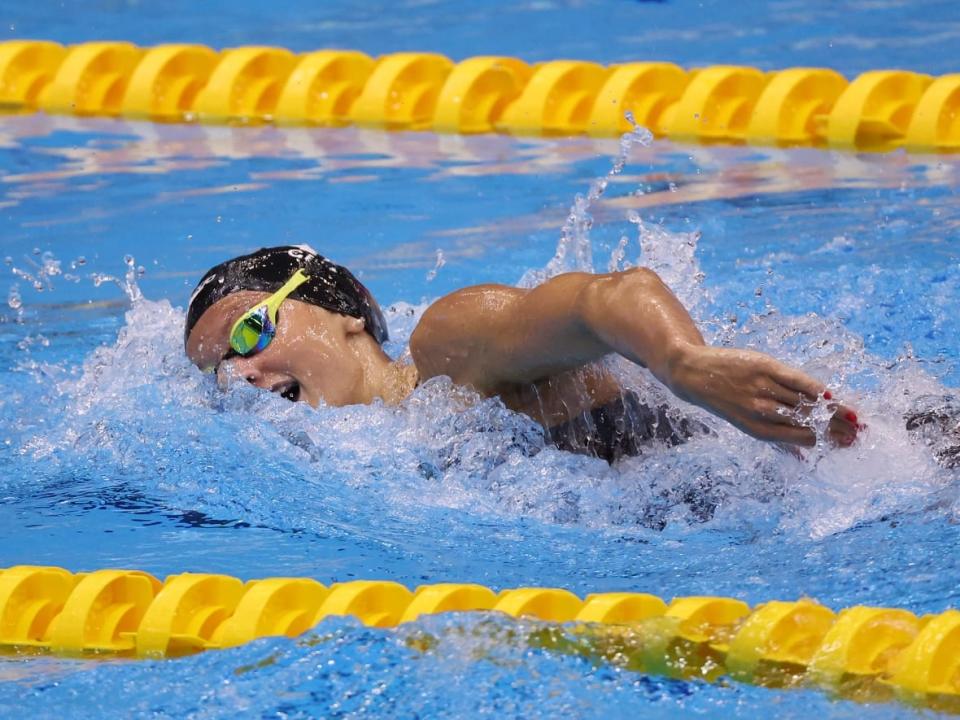 Canada's Summer McIntosh, seen in a file photo, defeated American legend Katie Ledecky in the 800m freestyle on Thursday. McIntosh's time of 8:11.39 sets the Canadian national record and makes her the second-fastest ever performer in the distance, behind only Ledecky. (Sarah Stier/Getty Images - image credit)