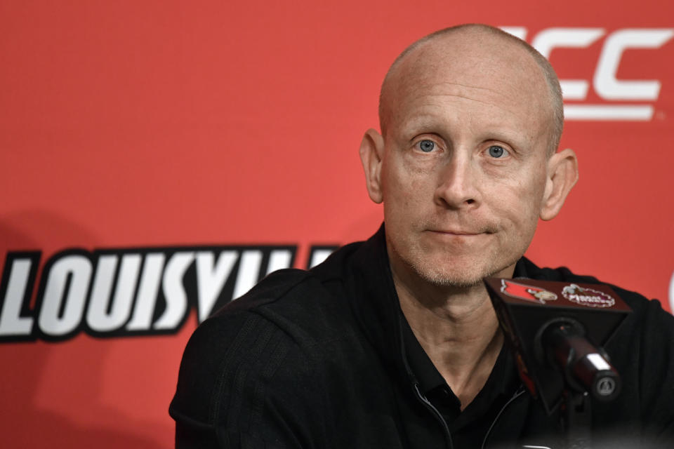 FILE - Louisville head coach Chris Mack answers questions during an NCAA college basketball news conference at the team's media day in Louisville, Ky., Tuesday, Oct. 19, 2021. An independent panel has placed the Louisville basketball program on two years of probation and fined it $5,000, but spared the school major penalties from NCAA allegations leveled in the aftermath of a federal investigation of corruption in college basketball. The Independent Accountability Resolution Process (IARP) also declined to penalize former Cardinals coach Rick Pitino, whom the NCAA initially cited for failure to promote an atmosphere of compliance. Chris Mack, Pitino's successor who was fired in January, also was not penalized for additional allegations announced last year by the NCAA. (AP Photo/Timothy D. Easley), File