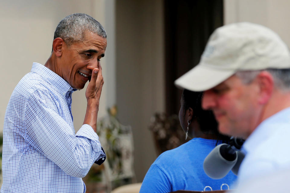 <p>President Barack Obama wipes the sweat from his face as he greets homeowners during a tour of a flood-affected neighborhood in Zachary, La., Aug. 23, 2016. (Photo: Jonathan Ernst/Reuters) </p>