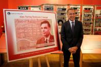 Bank of England governor Mark Carney presents the image of mathematician Alan Turing who will appear on a new 50 pound note at the Science and Industry Museum in Manchester