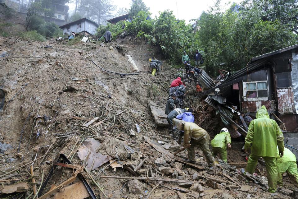 <p>Rescuers and paramedics and volunteers conduct search and retrieval operation to locate the three missing persons who were buried due to landslide caused by typhoon Mangkhut at Balacbac, Baguio City, north of Manila, Philippines on Sept. 16, 2018.<br>The number of people killed in the Philippines by typhoon Mangkhut rose to 25 while dozens are missing, according to provisional data gathered as emergency teams access areas struck by the storm.<br>(Photo by EPA) </p>