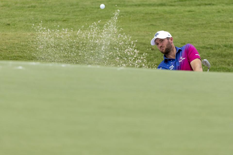 Sam Horsfield, of Majesticks GC, hits from a greenside bunker on the fourth hole during the final round of LIV Golf Nashville at The Grove, Sunday, June 23, 2024, in College Grove, Tenn. (Jon Ferrey/LIV Golf via AP)