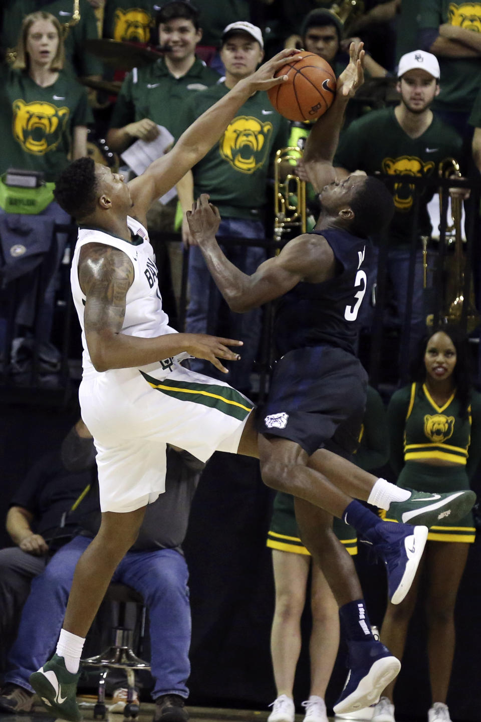 Baylor guard Mark Vital, left, blocks the shot of Butler guard Kamar Baldwin, right, late in the second half of an NCAA college basketball game, Tuesday, Dec. 10, 2019, in Waco, Texas. (AP Photo/Rod Aydelotte)