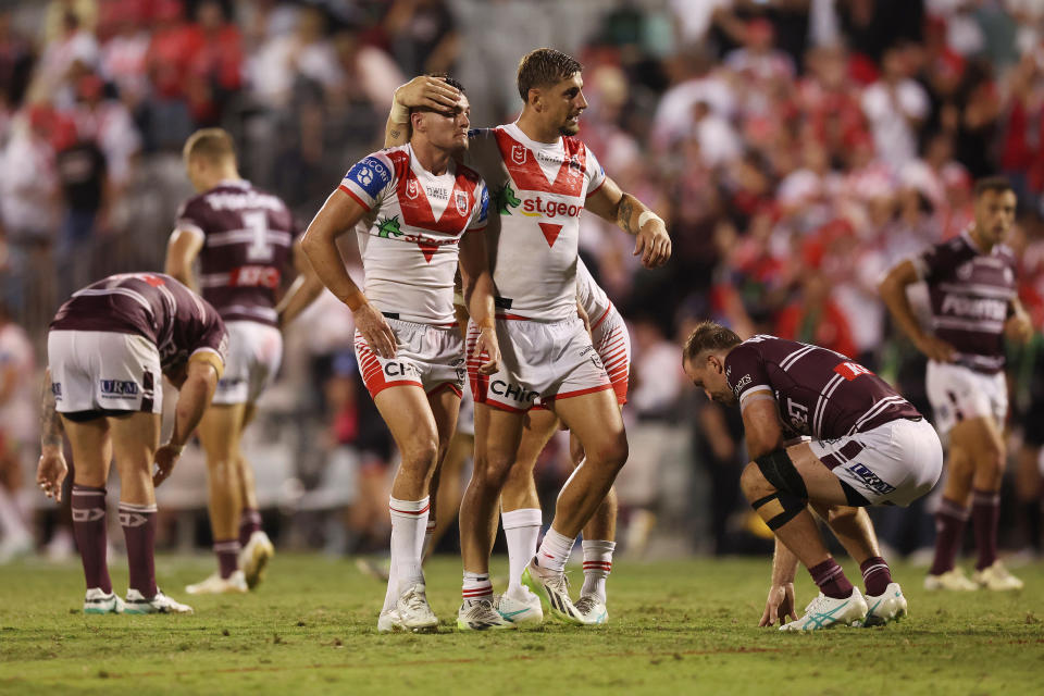 WOLLONGONG, AUSTRALIA - MARCH 30: Zac Lomax and Kyle Flanagan of the Dragons celebrate victory during the round four NRL match between St George Illawarra Dragons and Manly Sea Eagles at WIN Stadium, on March 30, 2024, in Wollongong, Australia. (Photo by Mark Metcalfe/Getty Images)