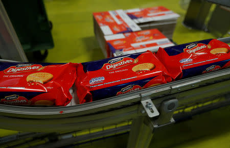 Packaged biscuits move along the production line of Pladis' McVities factory in London Britain, September 19, 2017. Picture taken September 19, 2017. REUTERS/Peter Nicholls.