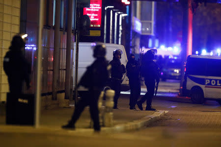 French special police forces secure an area during a police operation where the suspected gunman, Cherif Chekatt, who killed three people at a Christmas market in Strasbourg, was killed, in the Meinau district in Strasbourg, France, December 13, 2018. REUTERS/Christian Hartmann .