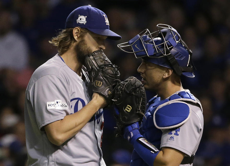 Clayton Kershaw, left, shares a moment with catcher Austin Barnes in October. (AP) 
