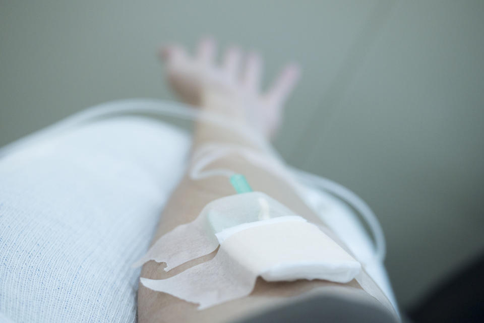 A patient hooked up to an IV drip