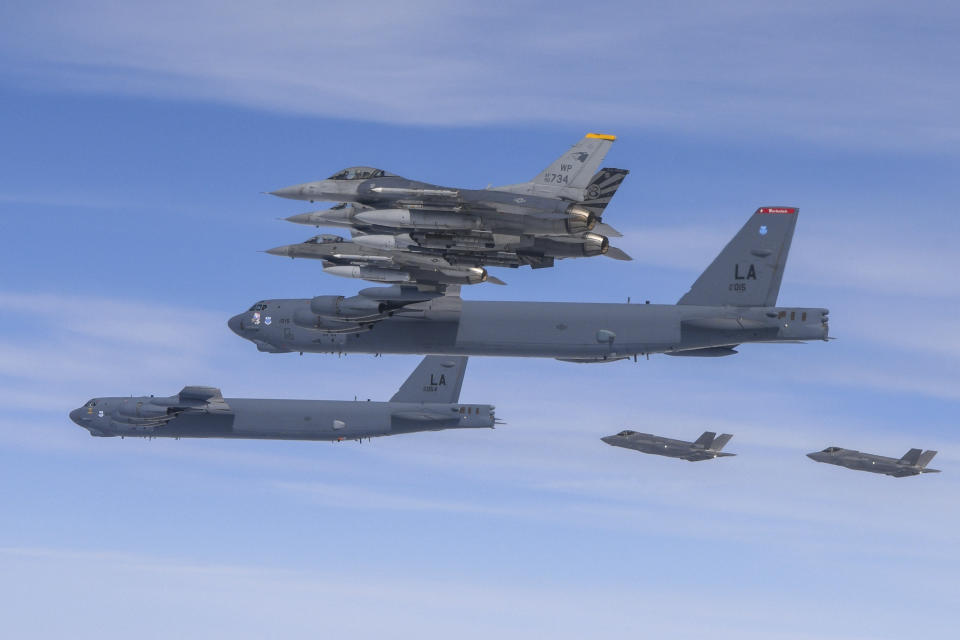 FILE - In this photo provided by South Korean Defense Ministry, U.S. B-52H bombers, center, and F-16 fighter jets and South Korean Air Force F-35A fighter jets, right bottom, fly over the Korean Peninsula during a joint air drill in South Korea on April 14, 2023. North Korea’s recent escalation of threats and endless tests of weapons aimed toward South Korea haven't done much to upset the calm in Seoul. Residents in the South's capital feel they've seen it all before and it's North Korea's way of getting attention in an election year for South Korea and the U.S. (South Korea Defense Ministry via AP, File)