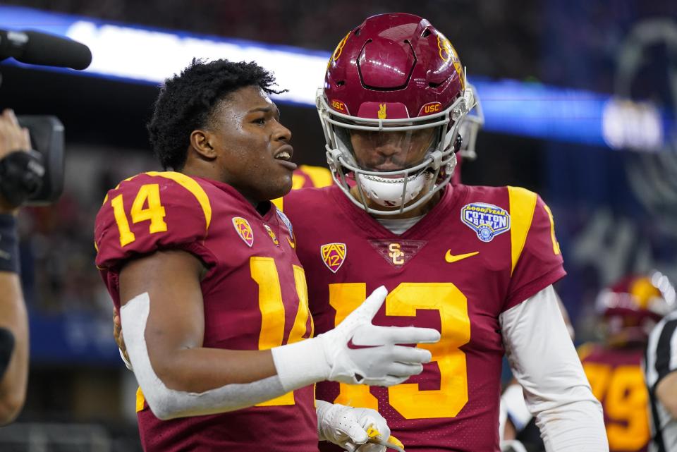 Southern California running back Raleek Brown is congratulated by quarterback Caleb Williams after scoring a touchdown during the first half of the Cotton Bowl NCAA college football game against Tulane, Monday, Jan. 2, 2023, in Arlington, Texas. (AP Photo/Sam Hodde)