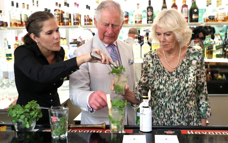 Prince Charles, Prince of Wales and Camilla, Duchess of Cornwall are shown how to prepare a mojito by Diana Figueroa (L) as they visit a paladar called Habanera - Getty/Chris Jackson