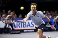 David Ferrer of Spain returns the ball to Andy Murray of Britain in their men's singles semi-final tennis match at the Paris Masters tennis tournament at the Bercy sports hall in Paris, France, November 7, 2015. REUTERS/Charles Platiau