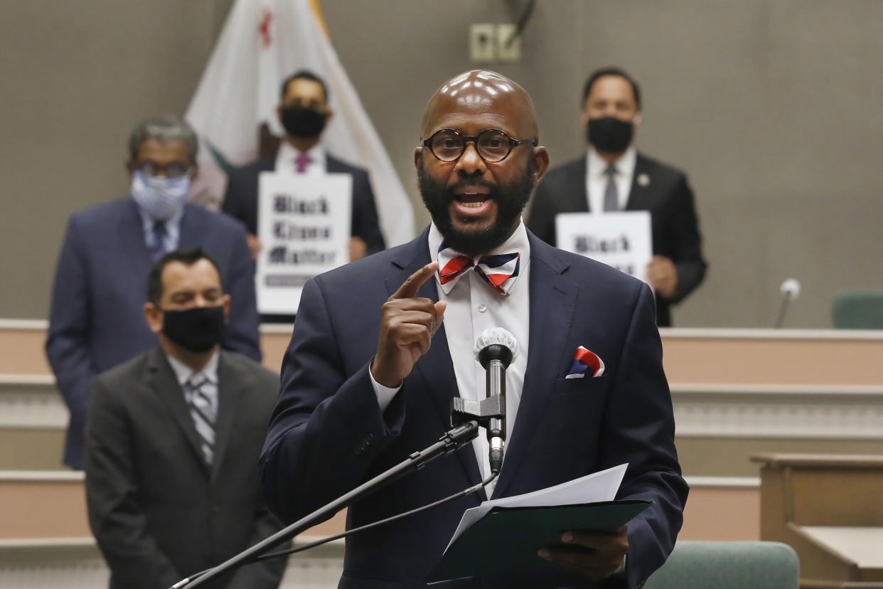 FILE - In this Monday, June 8, 2020, file photo, Assemblyman Mike Gipson, D-Carson, discusses the use of police choke holds at a news conference in Sacramento, Calif. On Tuesday, Jan. 4, 2022, Gipson announced legislation that would make it easier for people to sue gun companies for liability in shooting injuries or deaths. Gipson's son, his fiancee and another man were shooting victims in Los Angeles in April 2020. Gipson is the co-author of the legislation along with Democratic Assemblymen Chris Ward, of San Diego, and Phil Ting, of San Francisco. (AP Photo/Rich Pedroncelli, File )