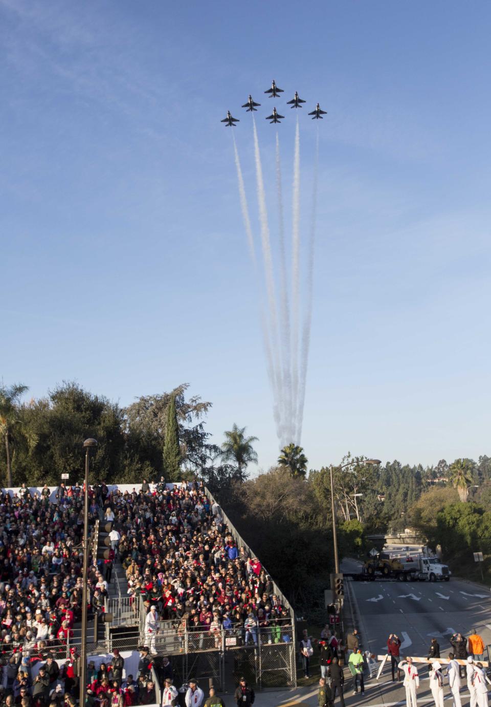 The United States Air Force Thunderbirds perform a flyover before the 125th Tournament of Roses Parade in Pasadena, Calif., Wednesday, Jan. 1, 2014. (AP Photo/Ringo H.W. Chiu)