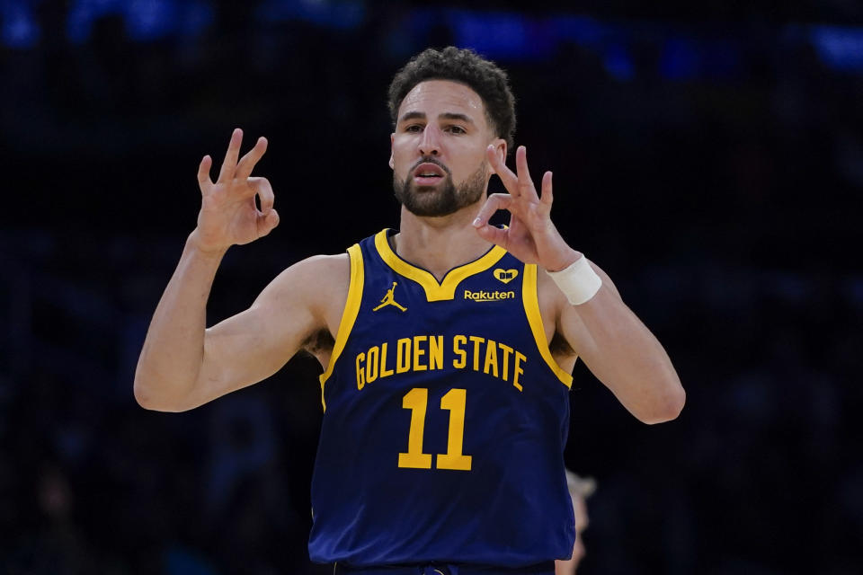 FILE - Golden State Warriors guard Klay Thompson gestures after making a 3-point basket against the Los Angeles Lakers during the second half of an NBA basketball game Tuesday, April 9, 2024, in Los Angeles. Klay Thompson is moving on from the Golden State Warriors, with the four-time league champion agreeing to join the Western Conference champion Dallas Mavericks and change franchises for the first time in his 13-year NBA career, two people with knowledge of the decision said Monday, July 1, 2024.(AP Photo/Ryan Sun)