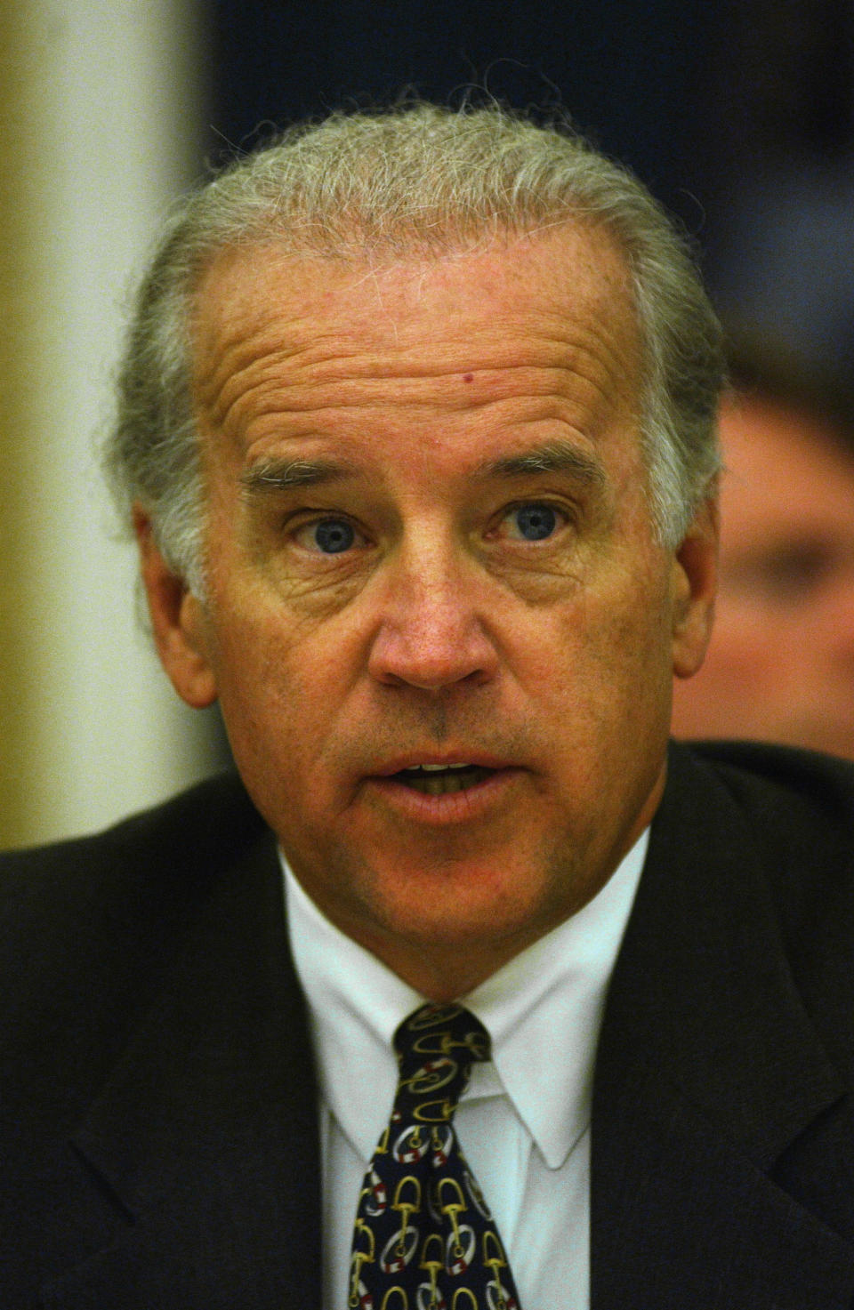 Close-up of Joe in a suit and tie