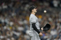 Chicago White Sox starting pitcher Dylan Cease tosses the ball on the mound before facing a San Diego Padres batter during the sixth inning of a baseball game Saturday, Oct. 1, 2022, in San Diego. (AP Photo/Gregory Bull)