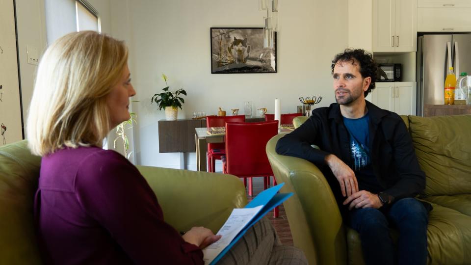 Sehaki speaks with Radio-Canada journalist Brigitte Bureau at his home in Gatineau, Que.