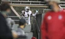 Miami wide receiver Mike Harley (3) celebrates after running into the stands following a 20-yard touchdown reception against North Carolina State during the first half of an NCAA college football game Friday, Nov. 6, 2020, in Raleigh, N.C. (Ethan Hyman/The News & Observer via AP, Pool)