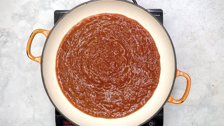 Heating marinara sauce in pan