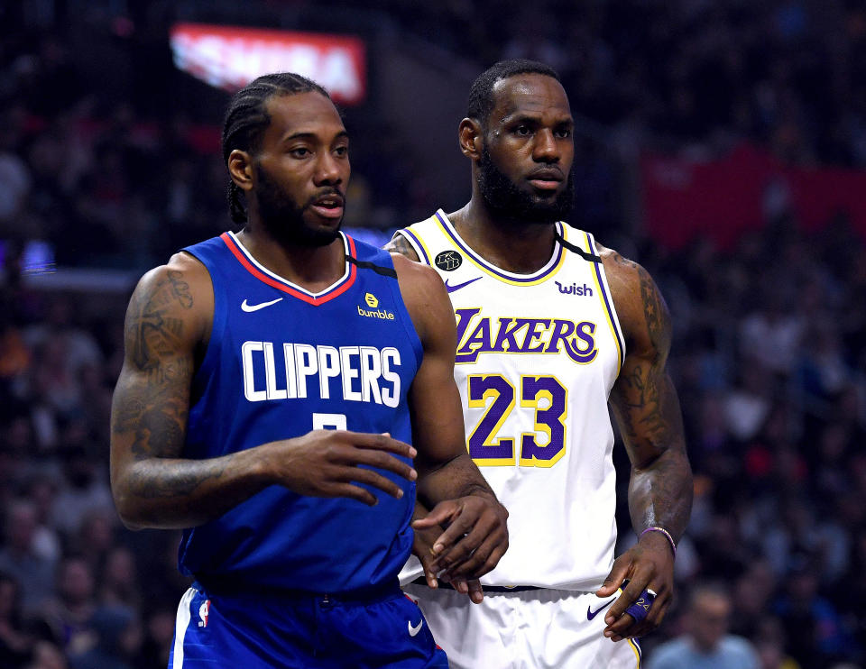 LOS ANGELES, CALIFORNIA - MARCH 08:  Kawhi Leonard #2 of the LA Clipper and LeBron James #23 of the Los Angeles Lakers during the first half at Staples Center on March 08, 2020 in Los Angeles, California.   NOTE TO USER: User expressly acknowledges and agrees that, by downloading and or using this photograph, User is consenting to the terms and conditions of the Getty Images License Agreement.  (Photo by Harry How/Getty Images)