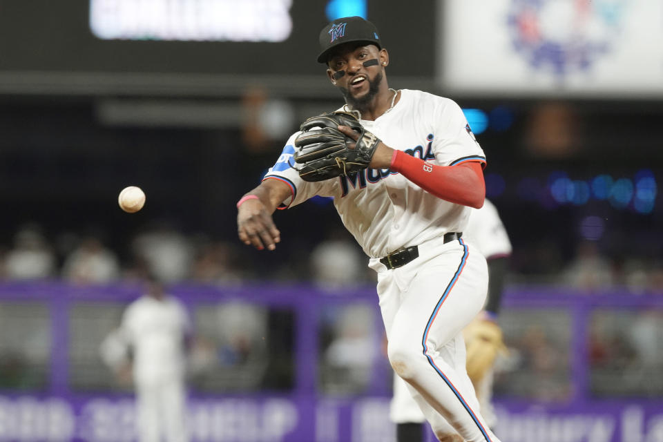 Miami Marlins shortstop Vidal Brujan throws to first base for an out during the seventh inning of a baseball game against the Boston Red Sox, Tuesday, July 2, 2024, in Miami. (AP Photo/Marta Lavandier)