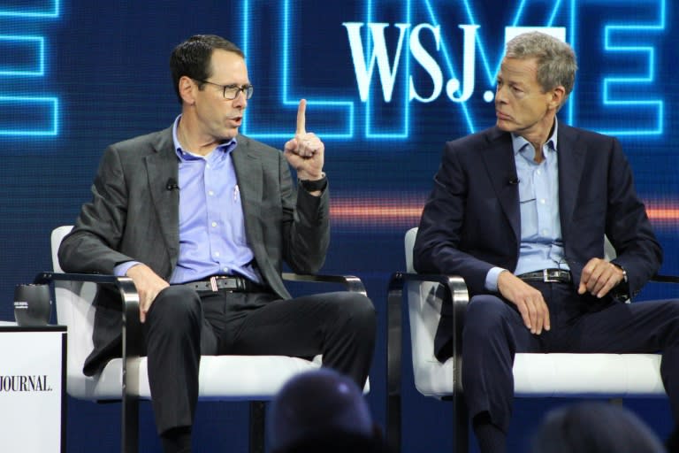 AT&T chief executive Randall Stephenson (L) and Time Warner chief executive Jeffrey Bewkes defend the proposed mega-merger of the companies at WSJD Live in Laguna Beach