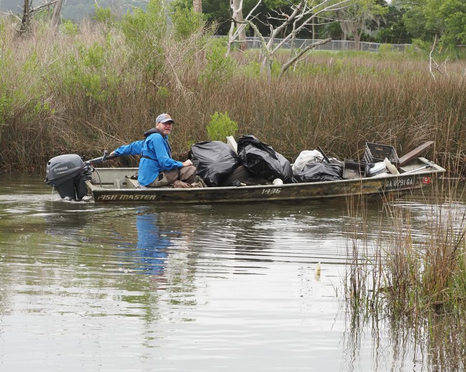 Ogeechee Riverkeeper Damon Mullis participates in a litter clean-up on the Vernon River.