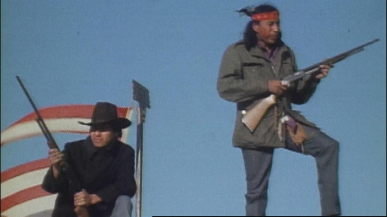 Two AIM members at Wounded Knee in 1973 (Photo: PBS)