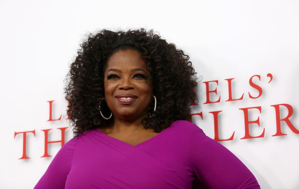 FILE - In this Aug. 12, 2013 file photo, Oprah Winfrey arrives at the Los Angeles premiere of "Lee Daniels' The Butler" at the Regal Cinemas L.A. Live Stadium 14, in Los Angeles. Winfrey is paying tribute to the late Nelson Mandela at the NAACP Image Awards on Saturday, Feb. 22, 2014. "12 Years a Slave," "Lee Daniels' The Butler," "Fruitvale Station," ''Mandela: Long Walk to Freedom" and "The Best Man Holiday" are vying for the outstanding motion picture trophy. (Photo by Matt Sayles/Invision/AP, file)