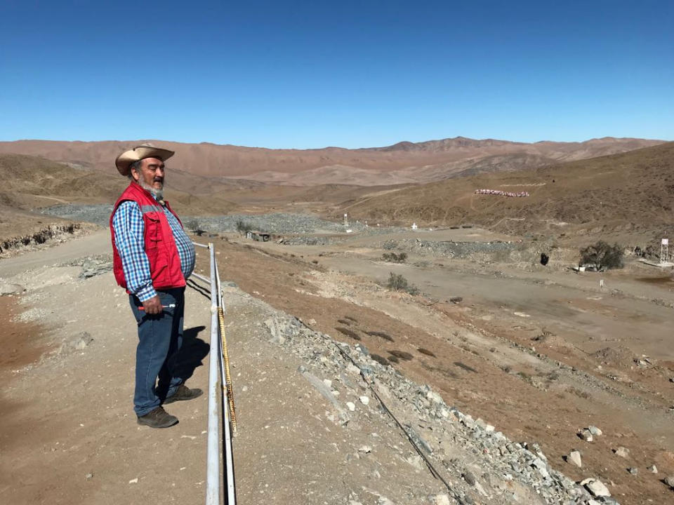 Jorge Galleguillos, one of the 33 Chilean miners who were trapped for 69 days underground in a copper and gold mine, stands in front of the landscape of the San Jose mine, in Copiapo, Chile July 5, 2018. REUTERS/Jorge Vega