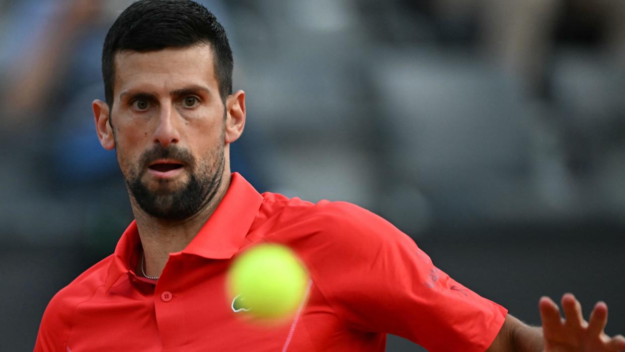 Novak Djokovic watches the ball