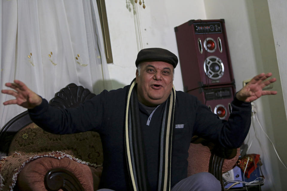 In this Tuesday, Jan. 29, 2019 photo, Palestinian actor and playwright Ali Abu Yaseen, 55, gives an interview in his home at the Shati refugee camp in Gaza City. A new documentary called “Gaza” is hitting the screens at the prestigious Sundance Film Festival this week, providing a colorful glimpse of life in the blockaded Hamas-ruled territory. But one of its main subjects, Abu Yaseen, won’t be attending the gathering due to the very circumstances depicted in the film. (AP Photo/Adel Hana)