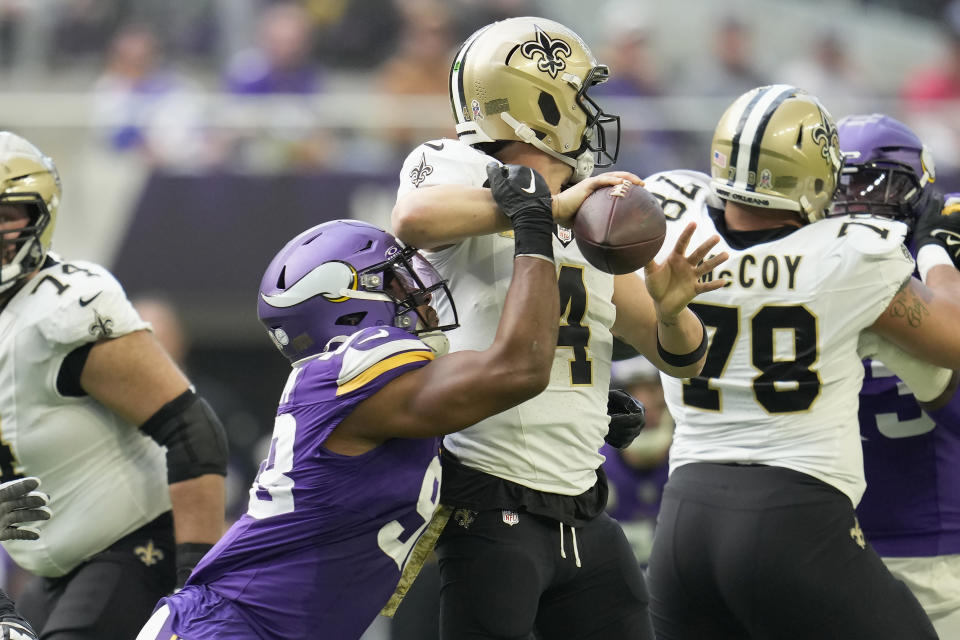 New Orleans Saints quarterback Derek Carr (4) is sacked by Minnesota Vikings linebacker D.J. Wonnum during the first half of an NFL football game Sunday, Nov. 12, 2023, in Minneapolis. (AP Photo/Abbie Parr)