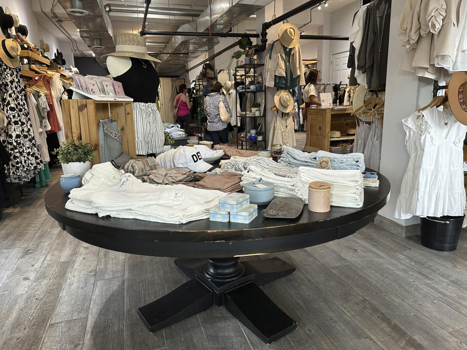 Items are displayed in a boutique along Tennyson Street Saturday, Aug. 5, 2023, in northwest Denver. The Commerce Department releases U.S. retail sales data for July. (AP Photo/David Zalubowski)