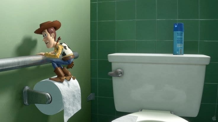 Woody from "Toy Story" standing on a roll of toilet paper