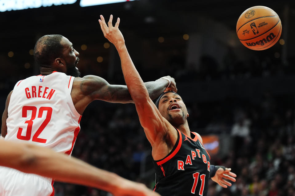 Houston Rockets forward Jeff Green (32) blocks a shot from Toronto Raptors forward Bruce Brown (11) during the second half of an NBA basketball game Friday, Feb. 9, 2024, in Toronto. (Frank Gunn/The Canadian Press via AP)