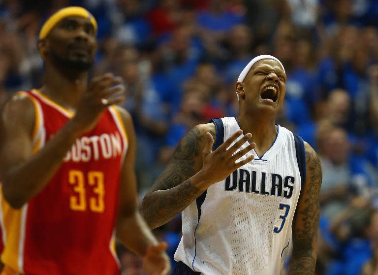 Charlie Villanueva (R) of the Dallas Mavericks reacts after making a 3-pointer against the Houston Rockets, during Game 4 of the Western Conference quarter-finals of the NBA playoffs, at American Airlines Center in Dallas, Texas, on April 26, 2015