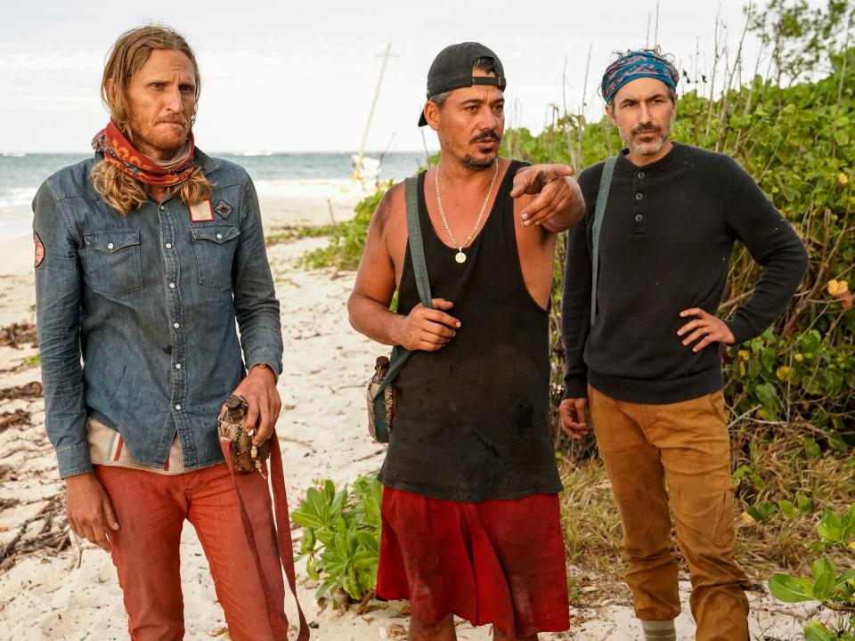 Tyson Apostol, Boston Rob Mariano and Ethan Zohn standing on the beach on "Survivor: Winners at War."