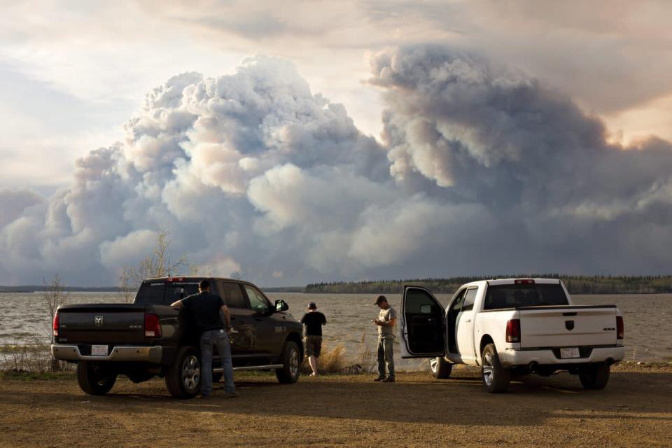 Evacuees watch the wildfire