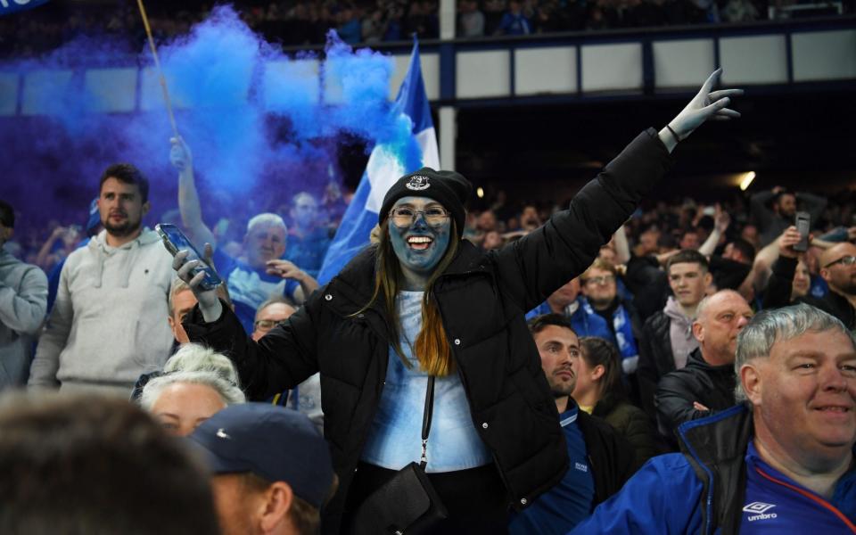 Everton fans celebrate following their sides victory as they avoid relegation  - GETTY IMAGES