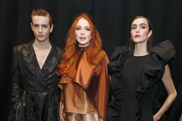 Gregory Pace/Shutterstock Lindsay Lohan with her brother, Dakota, and sister, Aliana, at the Christian Sirano New York Fashion Week show in February 2023