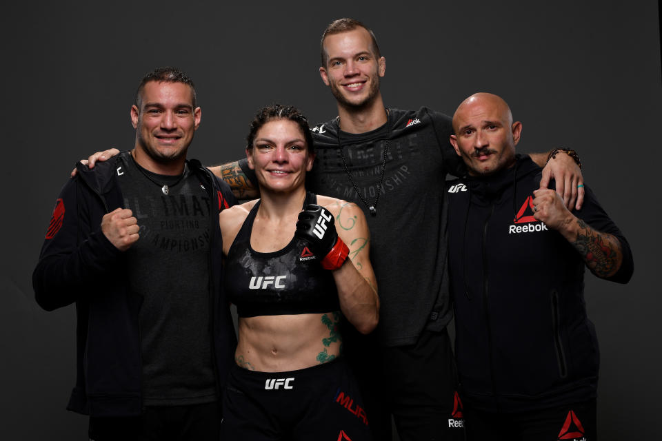 NEWARK, NJ - AUGUST 03:  Lauren Murphy poses for a portrait backstage with her team during the UFC Fight Night event at the Prudential Center on August 3, 2019 in Newark, New Jersey. (Photo by Mike Roach/Zuffa LLC/Zuffa LLC via Getty Images)