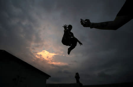 Vad Him of Rudex team jumps whilst on a rooftop in Moscow, Russia, August 14, 2017. REUTERS/Maxim Shemetov