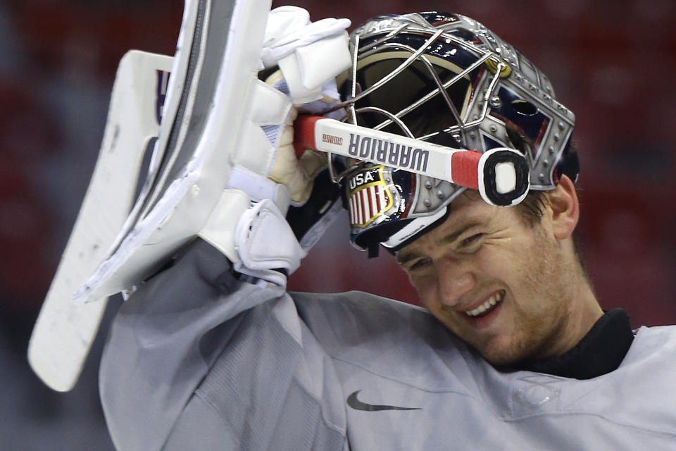 USA goaltender Jonathan Quick pulls his helmet down during a training session at the 2014 Winter Olympics, Monday, Feb. 10, 2014, in Sochi, Russia. (AP Photo/Julie Jacobson)
