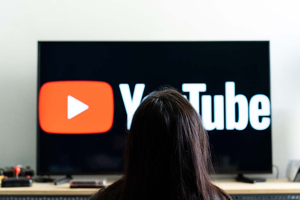  Person watching YouTube on a TV set. 