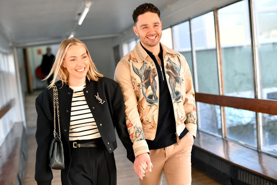 Adam Thomas and wife Caroline Daly visit their former secondary school, The Kingsway School, on January 20, 2023 in Manchester, England. (Photo by Anthony Devlin/Getty Images)